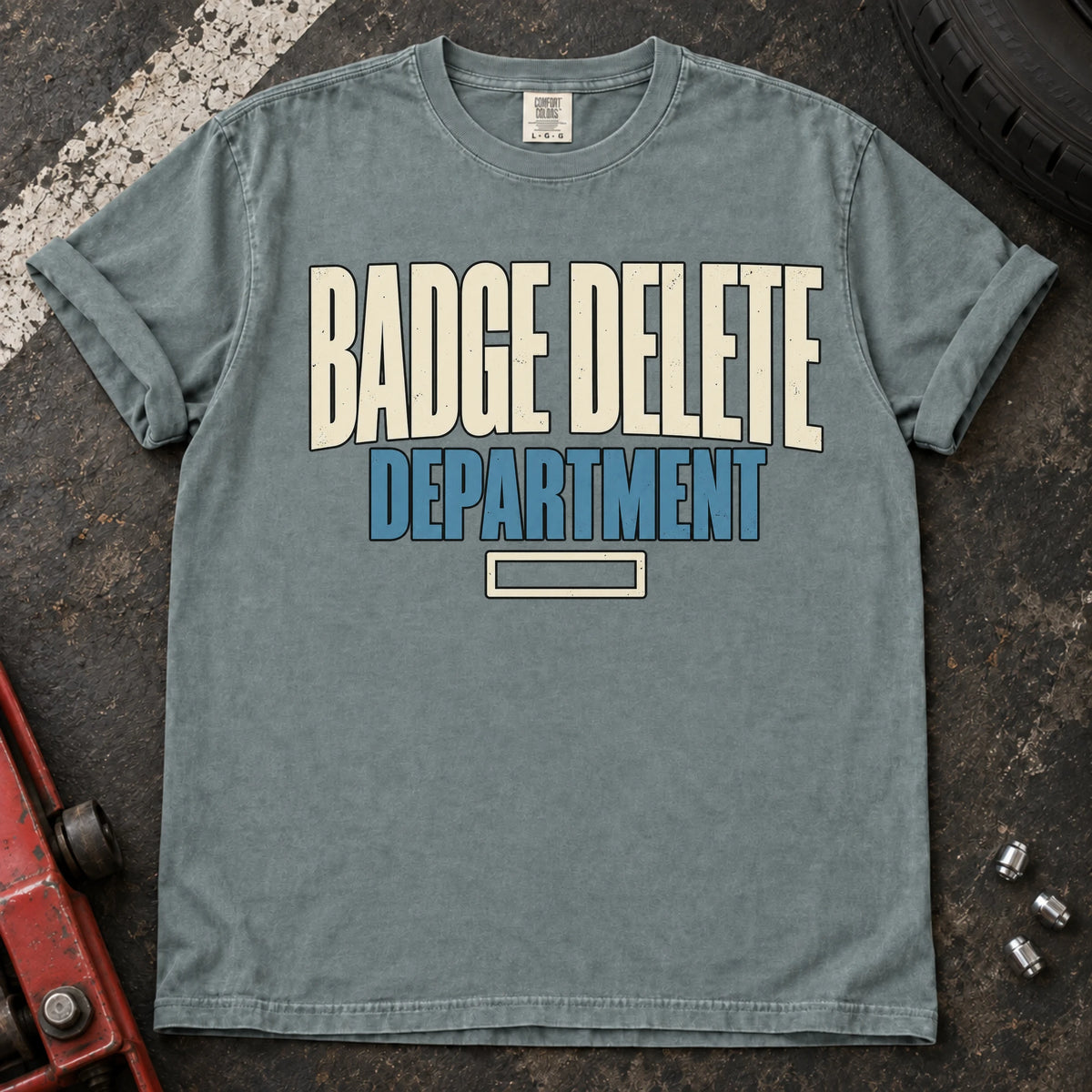 Bay car enthusiast T-shirt. Badge Delete Department, with a small empty badge outline.