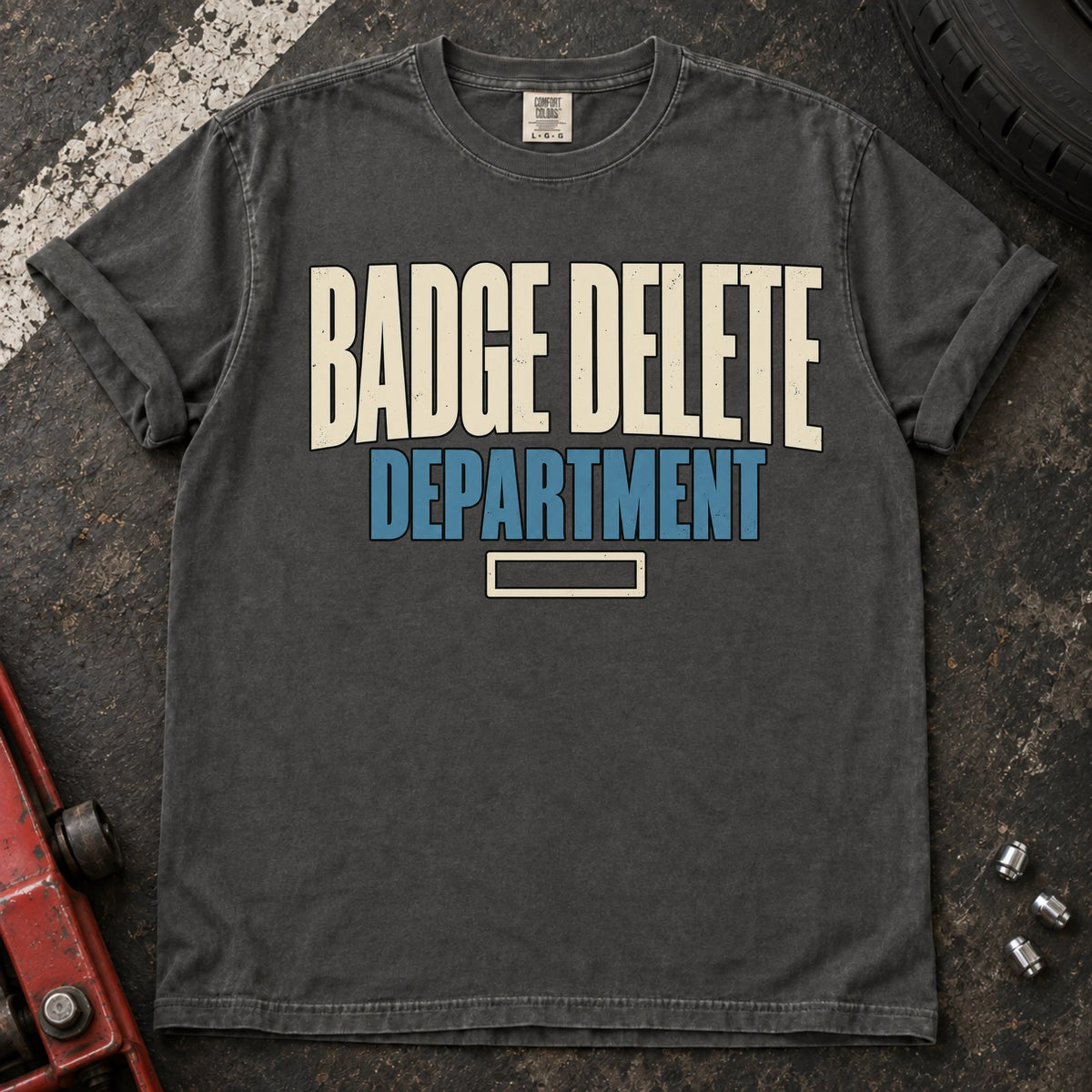 Pepper car enthusiast T-shirt. Badge Delete Department, with a small empty badge outline.