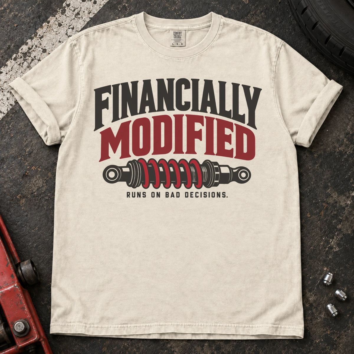 Ivory car enthusiast T-shirt. A coilover gives financially modified, runs on bad decisions a garage-humor twist.