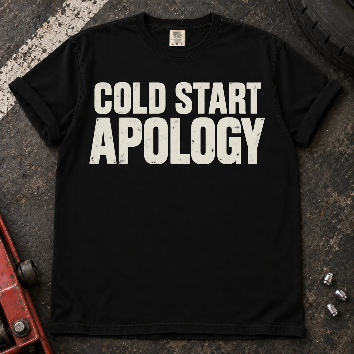 Black car enthusiast T-shirt. Cold start apology, in bold understated automotive lettering.