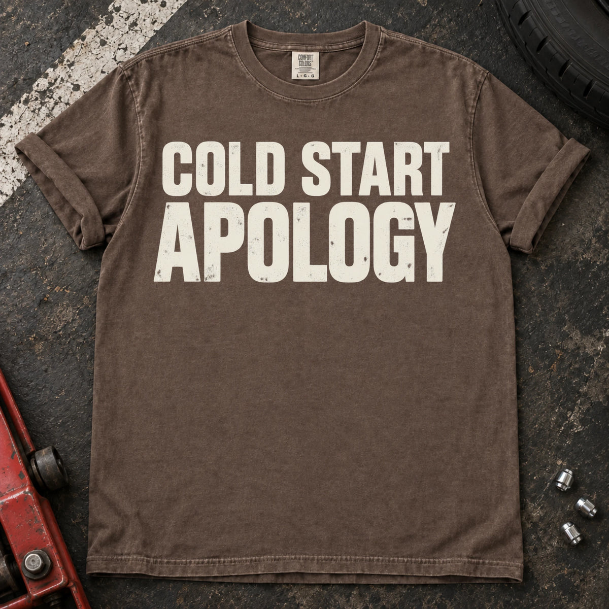 Espresso car enthusiast T-shirt. Cold start apology, in bold understated automotive lettering.