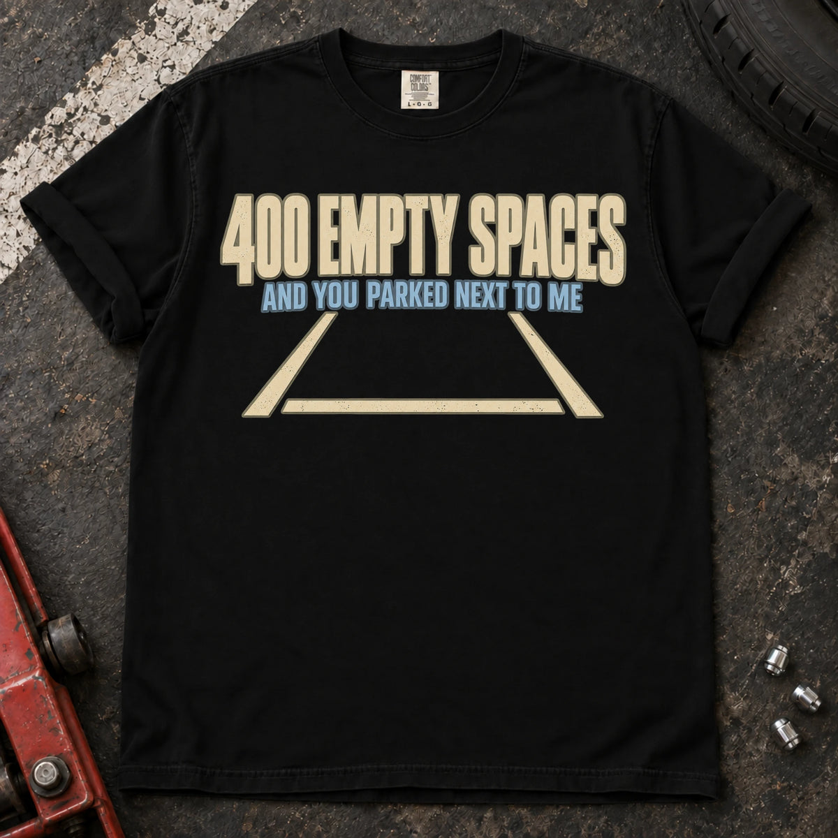 Black car enthusiast T-shirt. An empty parking bay asks why someone parked beside you among 400 spaces.