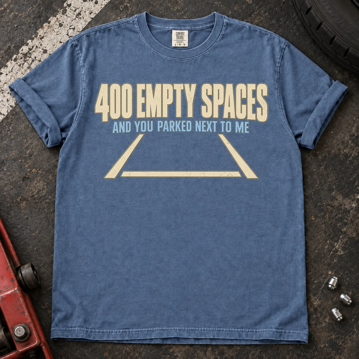 Blue Jean car enthusiast T-shirt. An empty parking bay asks why someone parked beside you among 400 spaces.