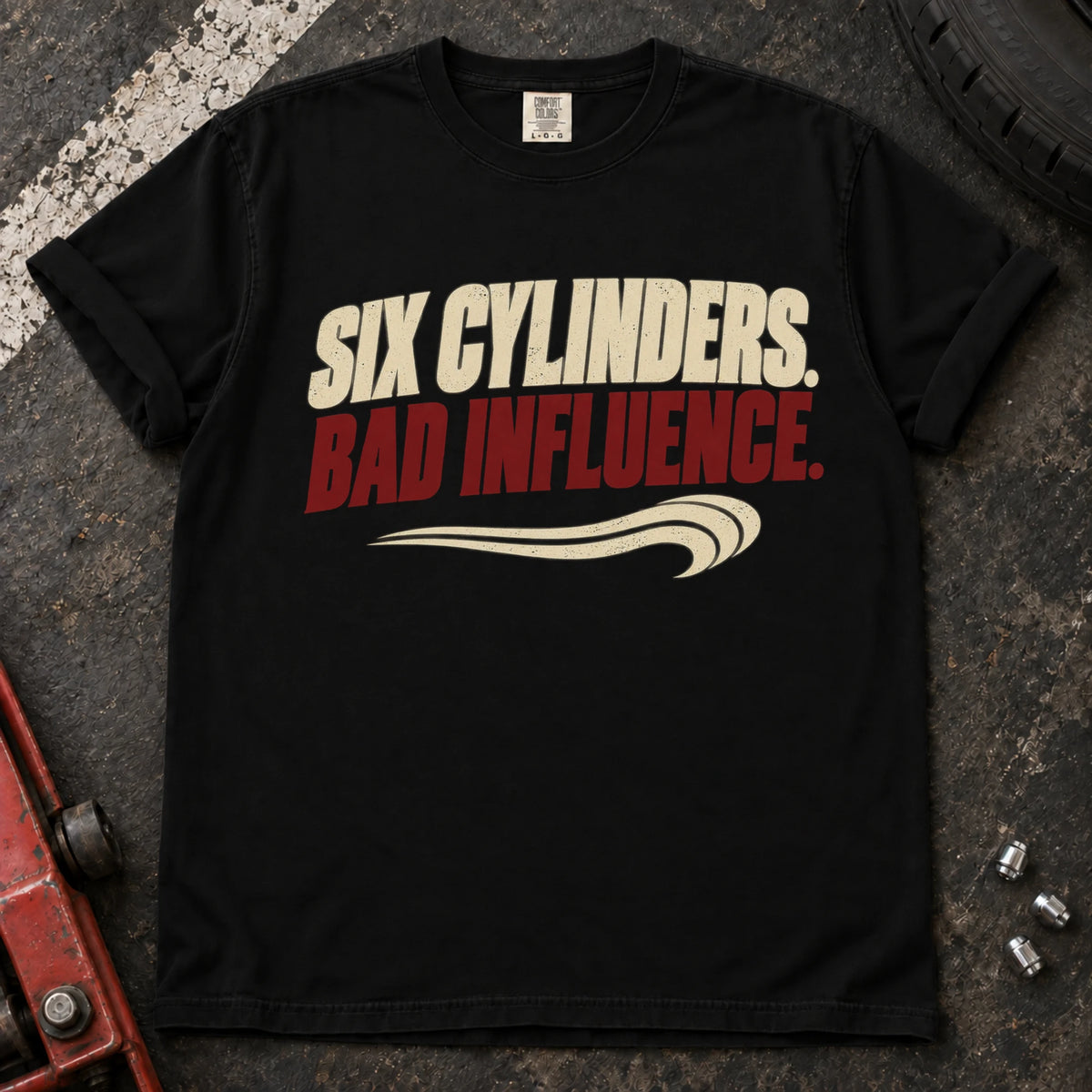Black car enthusiast T-shirt. Six cylinders, bad influence, with a sweeping exhaust-style accent.