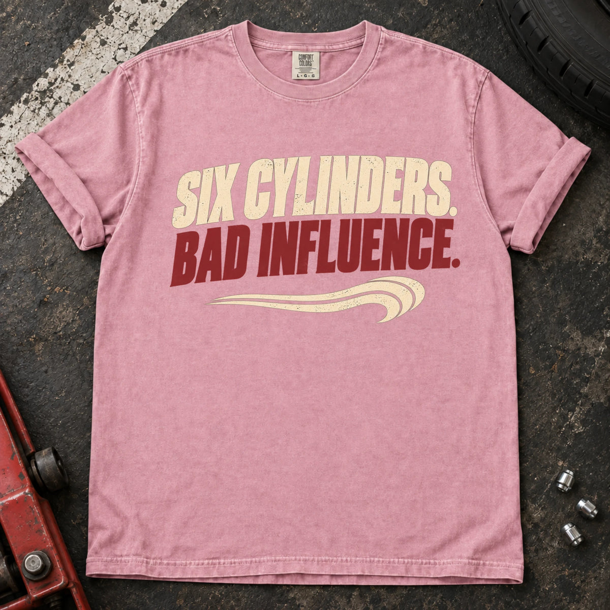 Blossom car enthusiast T-shirt. Six cylinders, bad influence, with a sweeping exhaust-style accent.