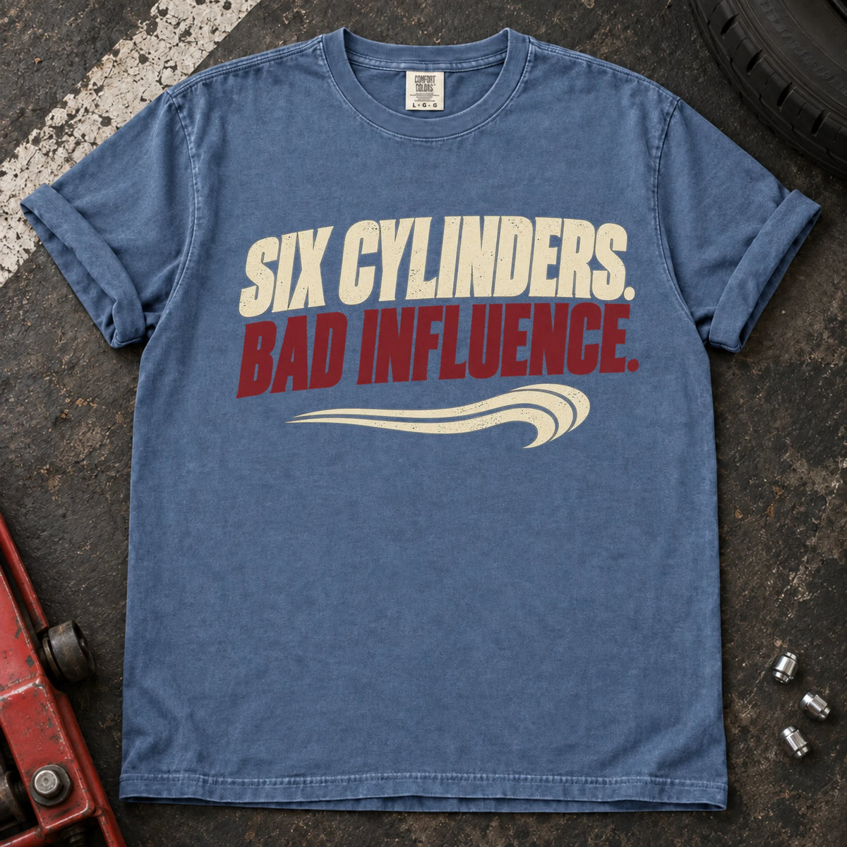 Blue Jean car enthusiast T-shirt. Six cylinders, bad influence, with a sweeping exhaust-style accent.