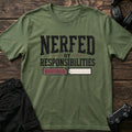 Military Green gaming T-shirt. A cracked health bar shows a player nerfed by responsibilities.