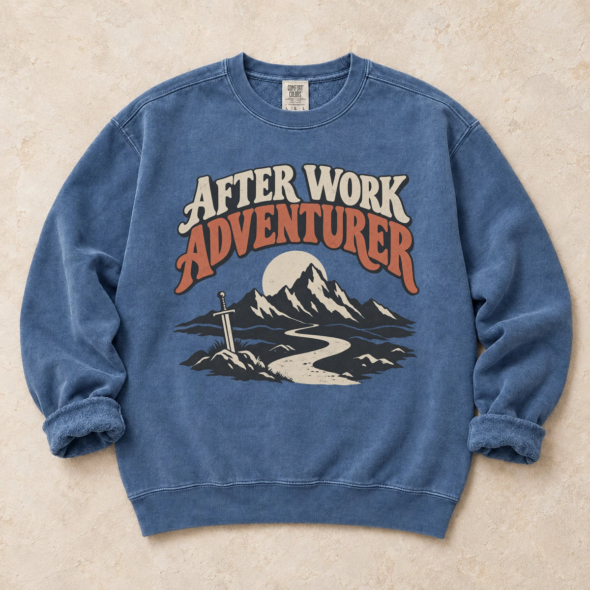 Blue Jean gaming sweatshirt. An after-work adventurer follows a mountain trail toward a planted sword.
