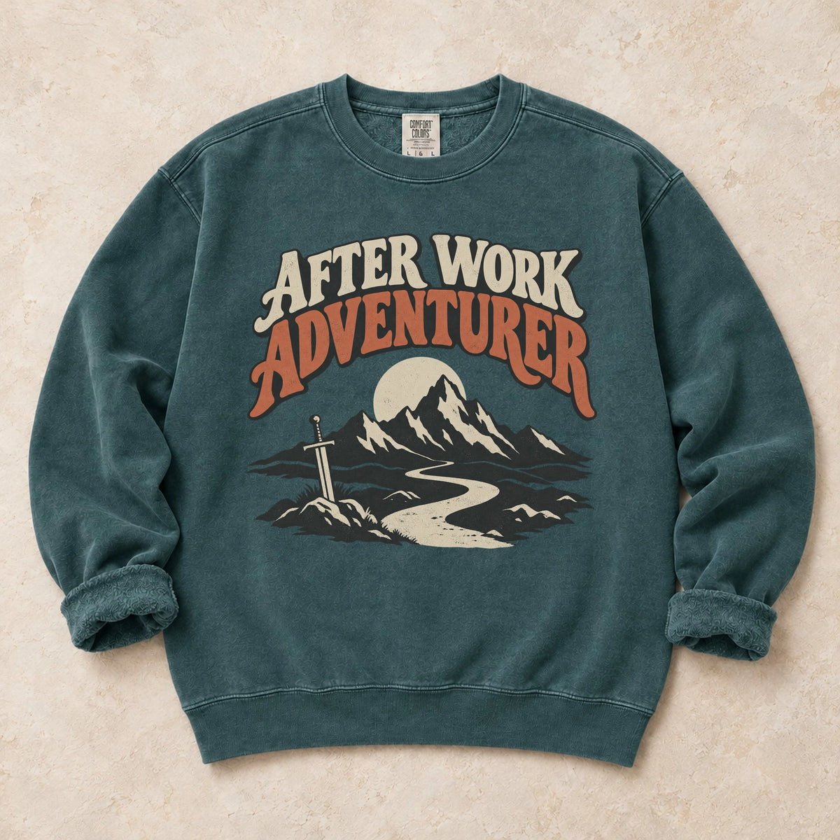 Blue Spruce gaming sweatshirt. An after-work adventurer follows a mountain trail toward a planted sword.