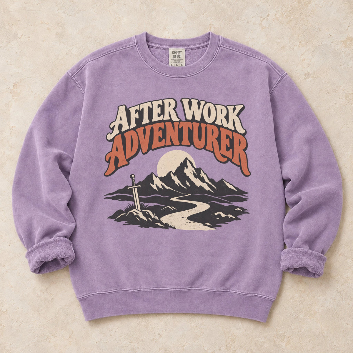 Orchid gaming sweatshirt. An after-work adventurer follows a mountain trail toward a planted sword.