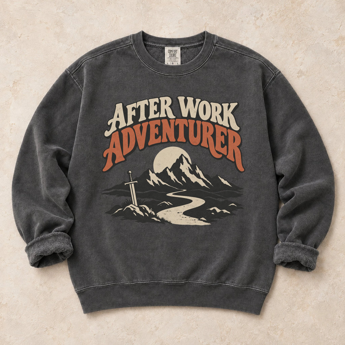 Pepper gaming sweatshirt. An after-work adventurer follows a mountain trail toward a planted sword.