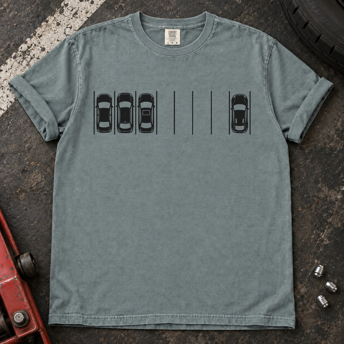 Bay T-shirt with a minimal overhead parking diagram showing one car parked away from three others.