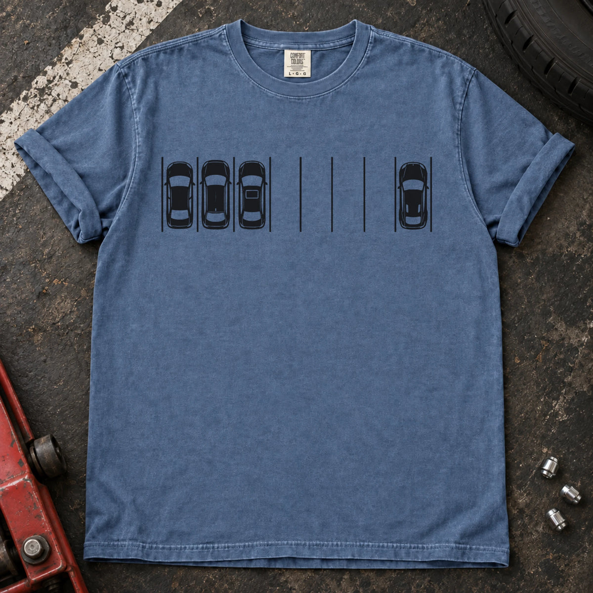 Blue Jean T-shirt with a minimal overhead parking diagram showing one car parked away from three others.
