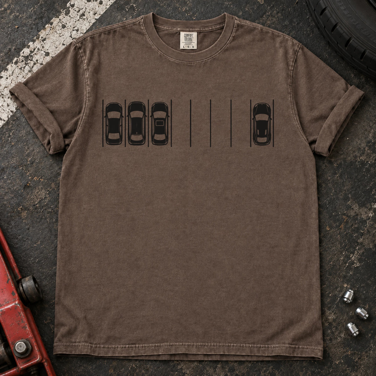 Espresso T-shirt with a minimal overhead parking diagram showing one car parked away from three others.