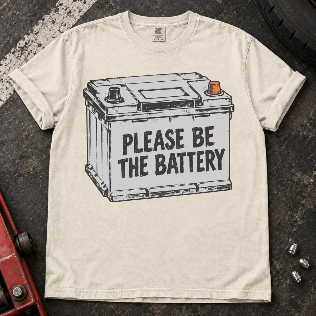 Ivory car enthusiast T-shirt. A battery illustration carries the hopeful plea, please be the battery.