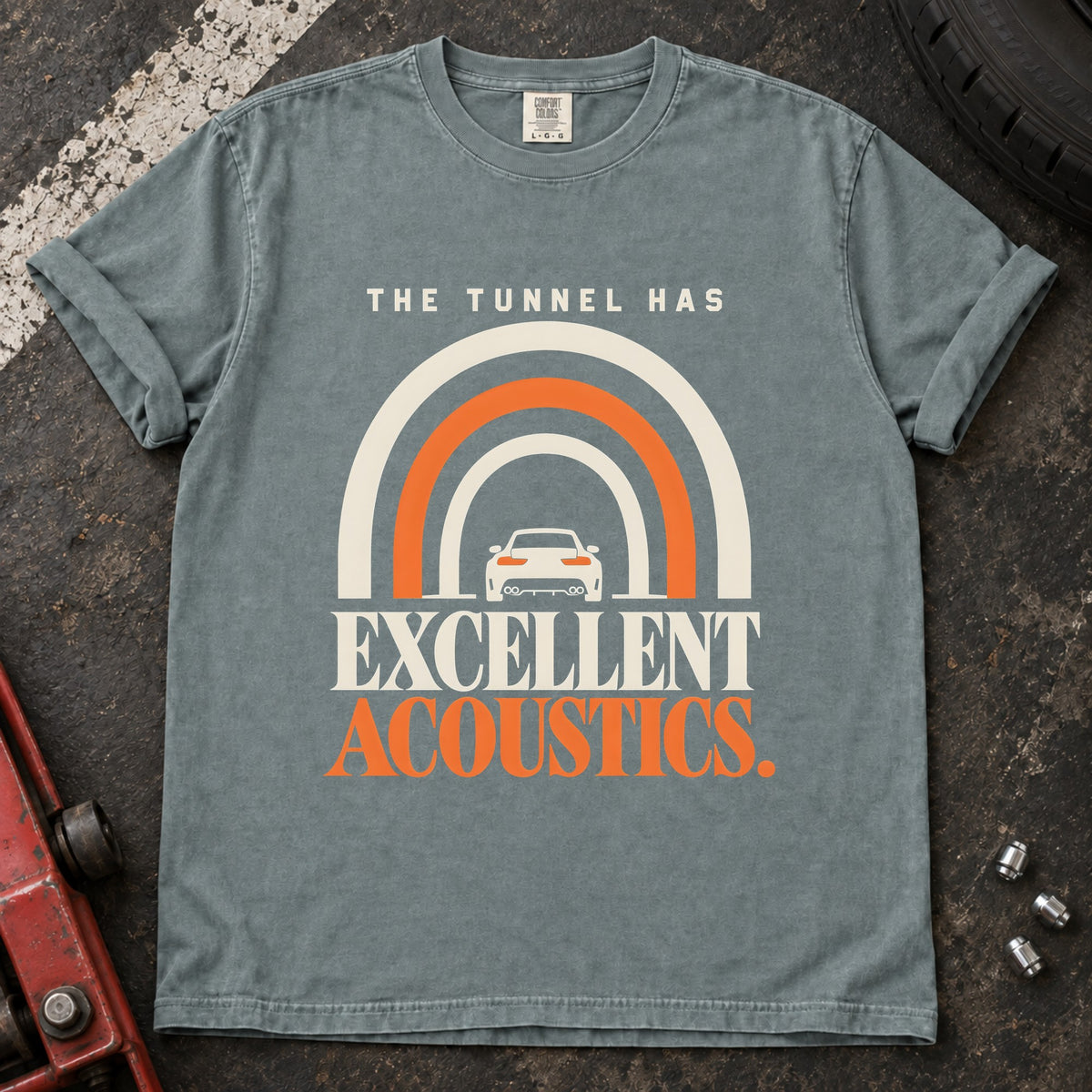 Bay T-shirt showing a car beneath a tunnel-shaped arch with 'The tunnel has excellent acoustics'.