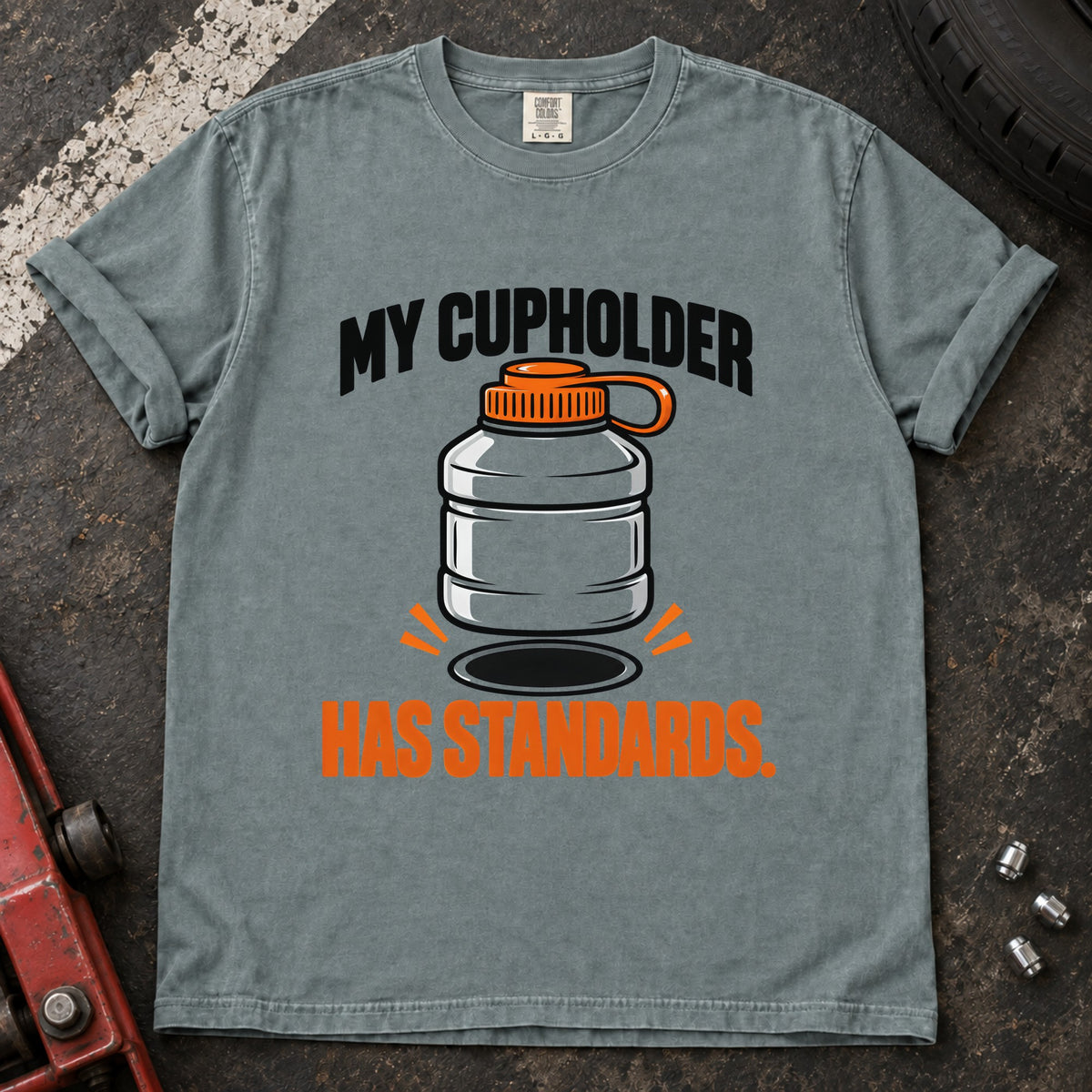 Bay T-shirt showing an oversized bottle and cupholder with 'My cupholder has standards'.