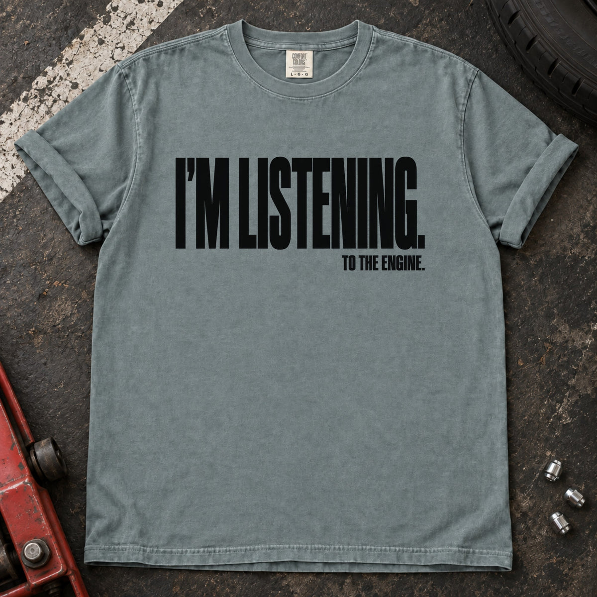 Bay T-shirt with bold condensed lettering reading 'I'm listening to the engine'.