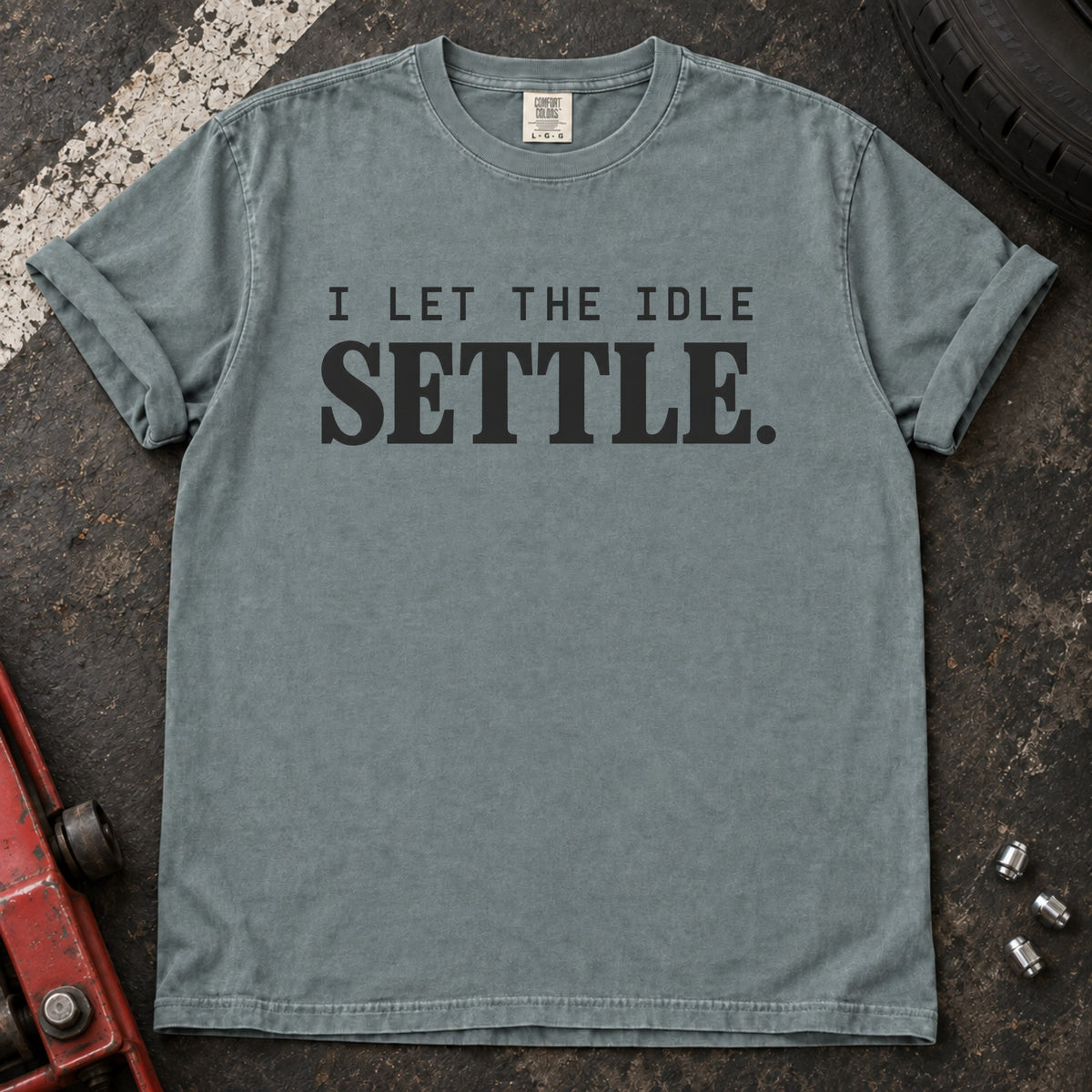 Bay T-shirt with spaced lettering reading 'I let the idle settle'.