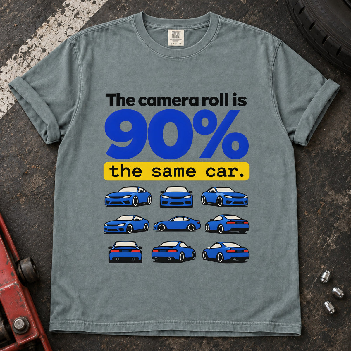 Bay T-shirt showing a grid of small blue cars with 'The camera roll is 90% the same car'.