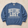 Blue Jean gaming sweatshirt. A drained progress bar admits bedtime lost.