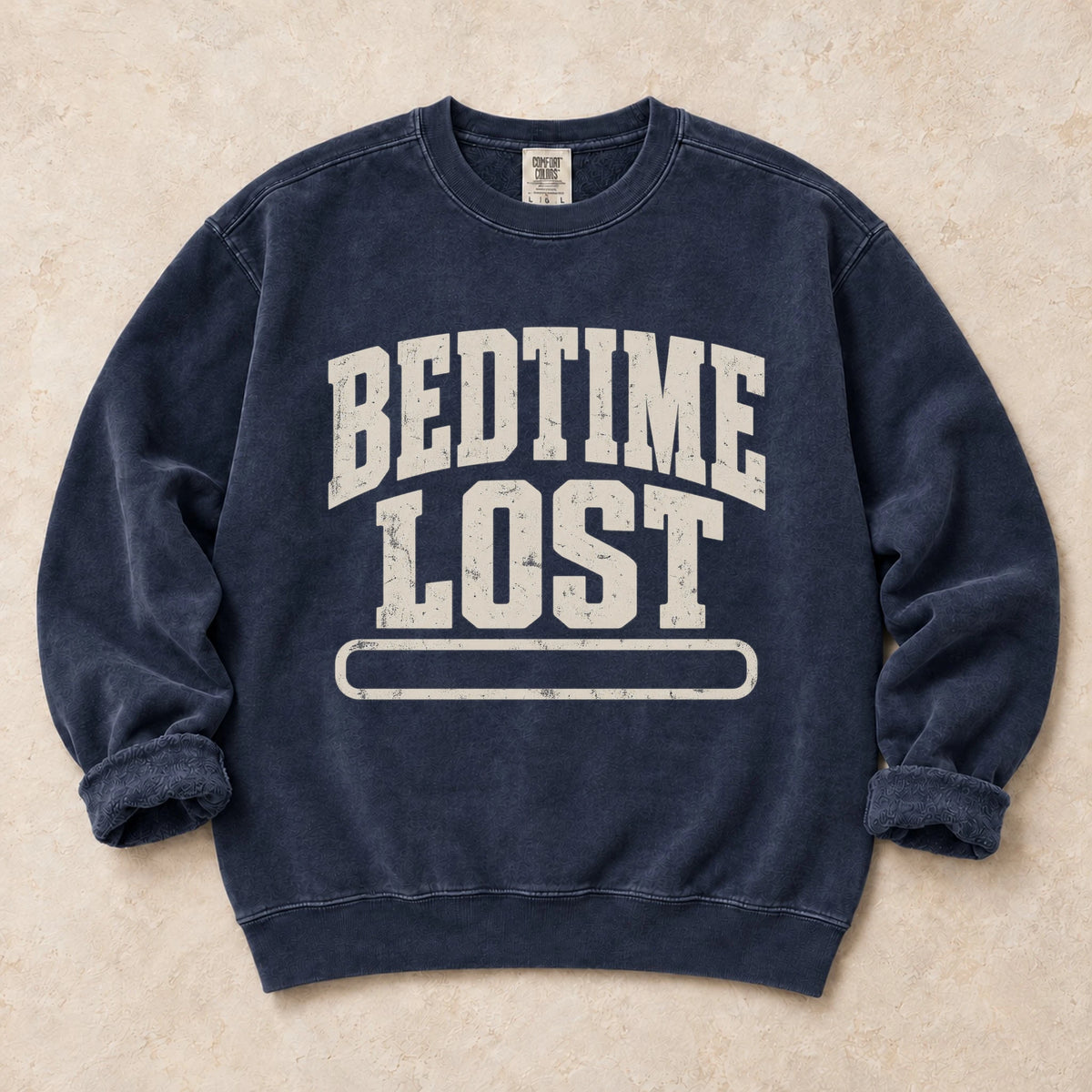 True Navy gaming sweatshirt. A drained progress bar admits bedtime lost.