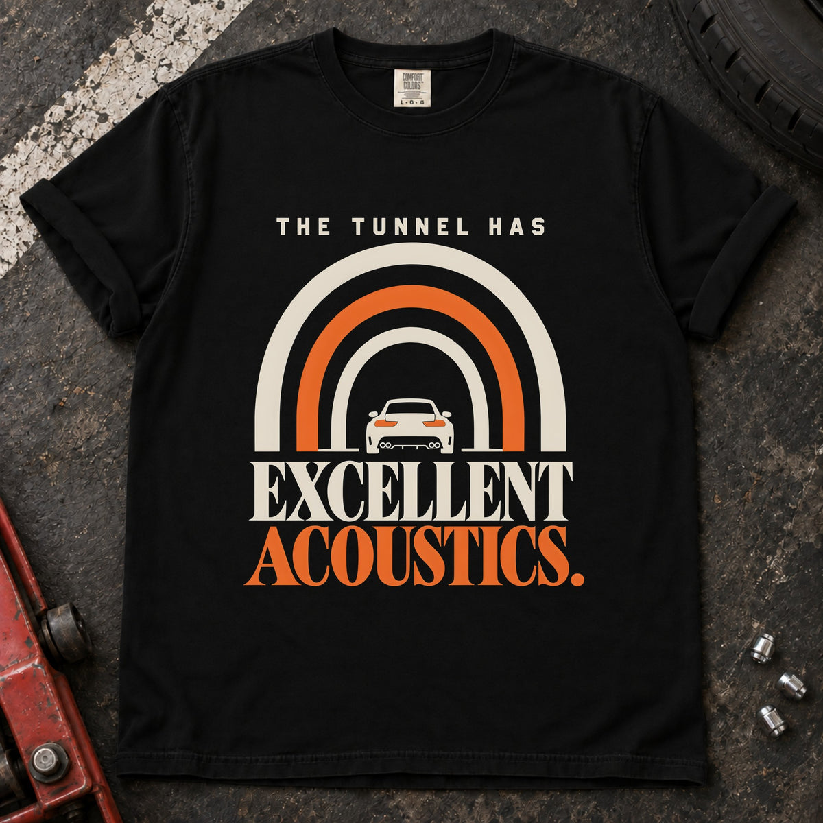 Black T-shirt showing a car beneath a tunnel-shaped arch with 'The tunnel has excellent acoustics'.