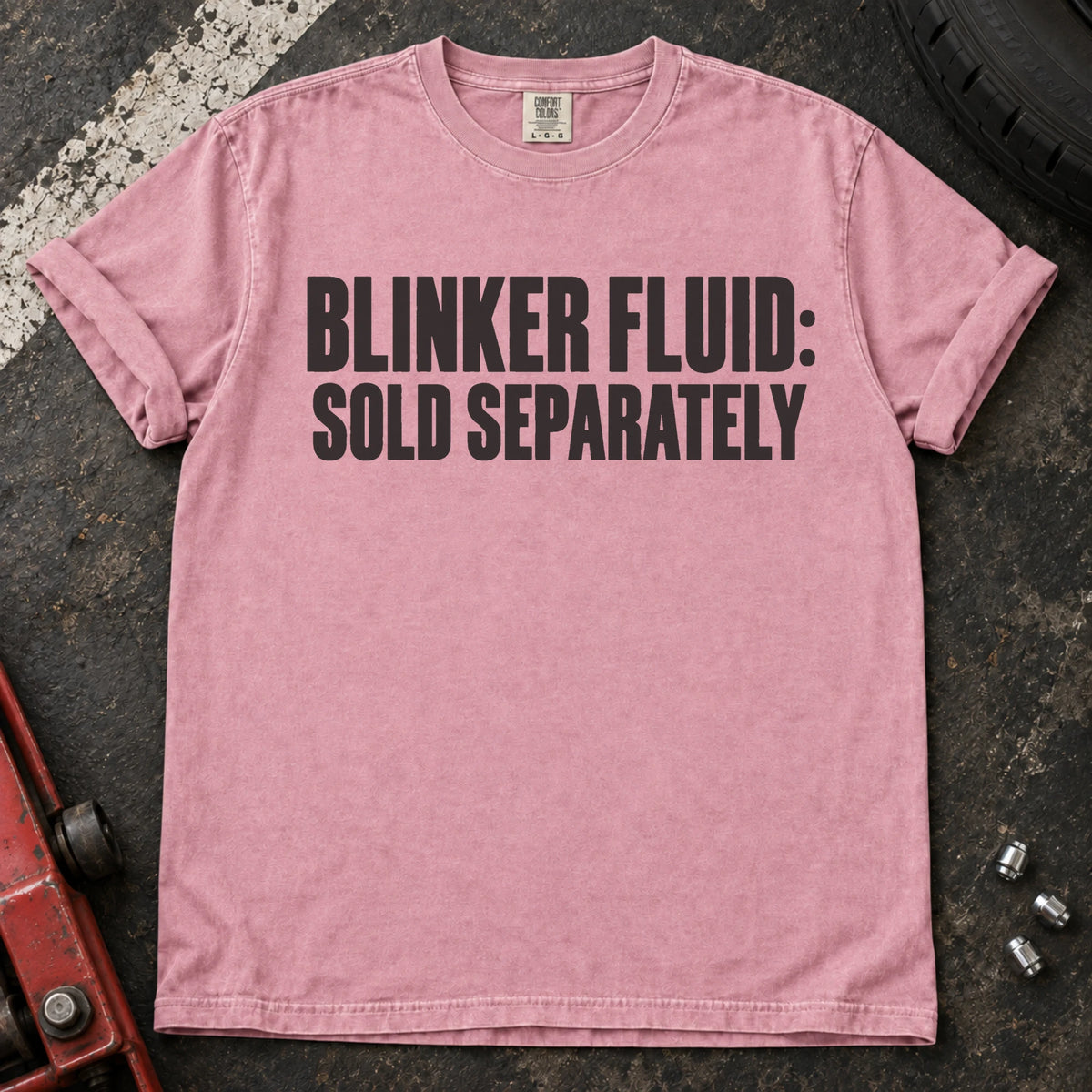 Blossom car enthusiast T-shirt. Blinker fluid sold separately, in dry automotive-humor lettering.