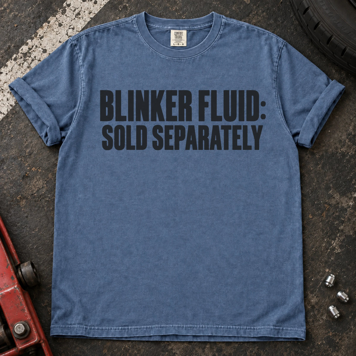 Blue Jean car enthusiast T-shirt. Blinker fluid sold separately, in dry automotive-humor lettering.