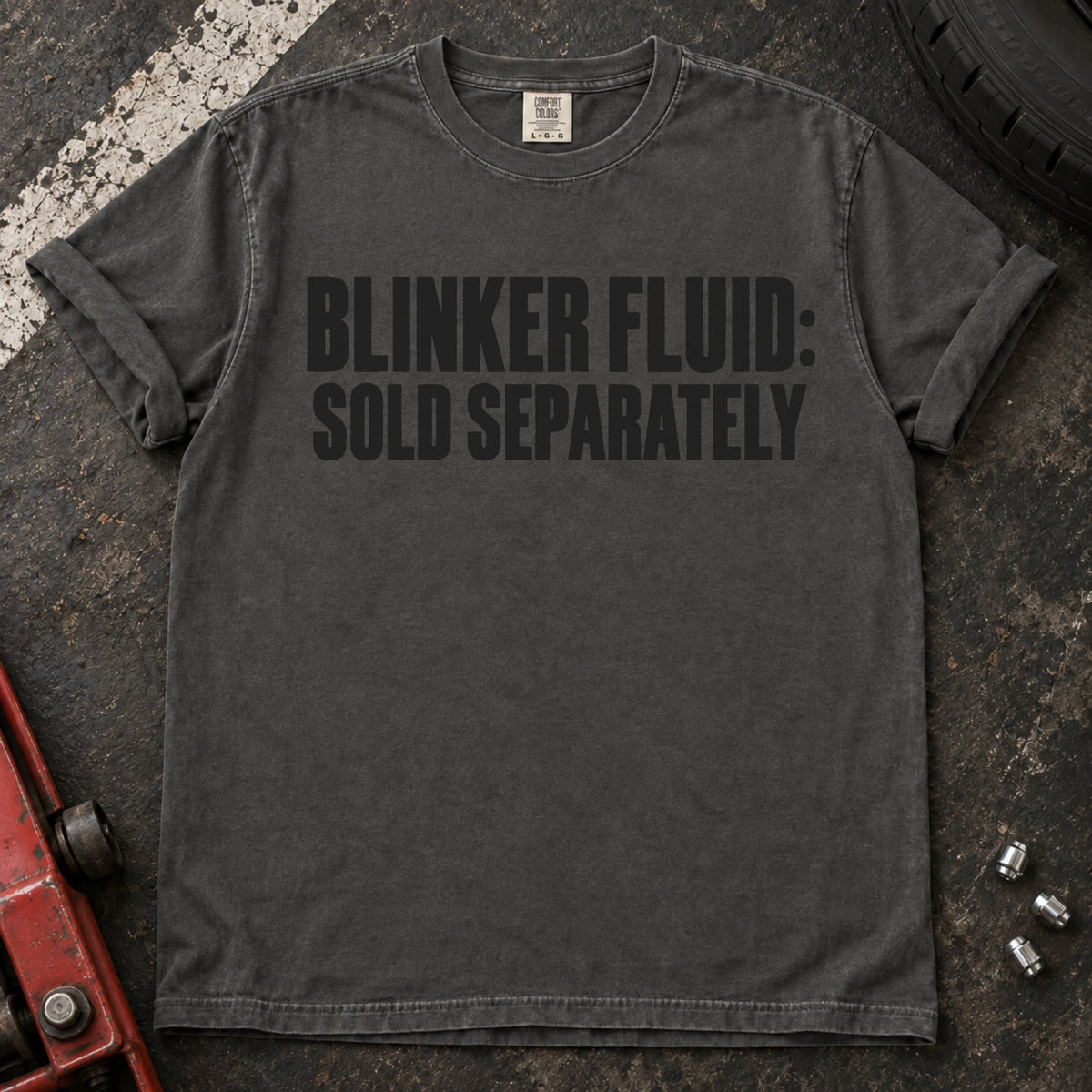 Pepper car enthusiast T-shirt. Blinker fluid sold separately, in dry automotive-humor lettering.