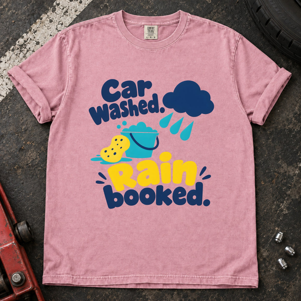 Blossom T-shirt showing a rain cloud, droplets and cleaning sponge with 'Car washed. Rain booked'.