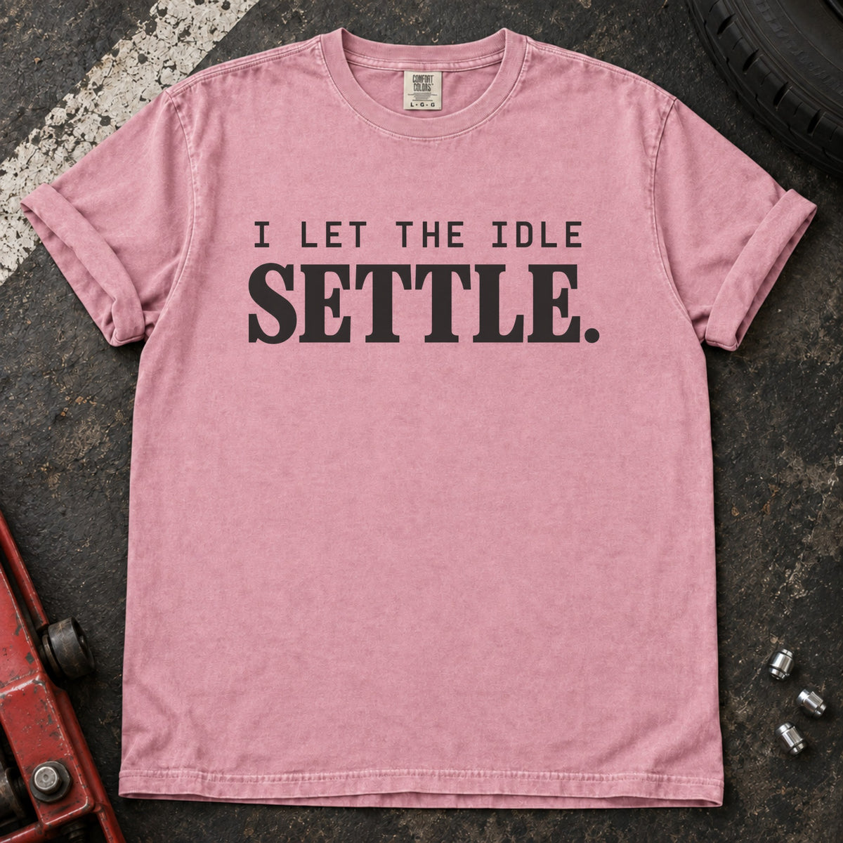 Blossom T-shirt with spaced lettering reading 'I let the idle settle'.