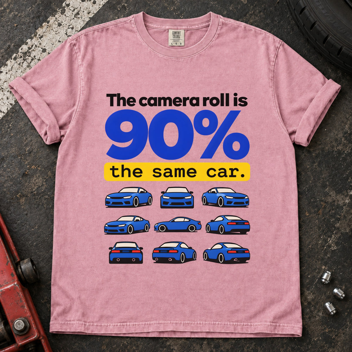 Blossom T-shirt showing a grid of small blue cars with 'The camera roll is 90% the same car'.