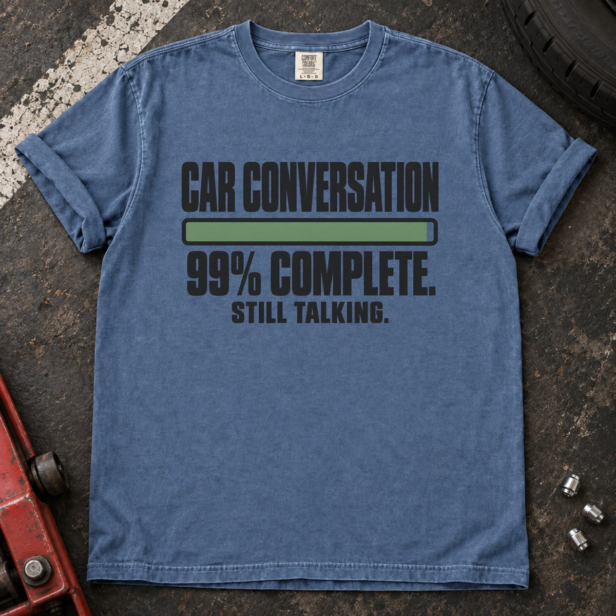 Blue Jean T-shirt showing a nearly full progress bar with 'Car conversation 99% complete. Still talking'.