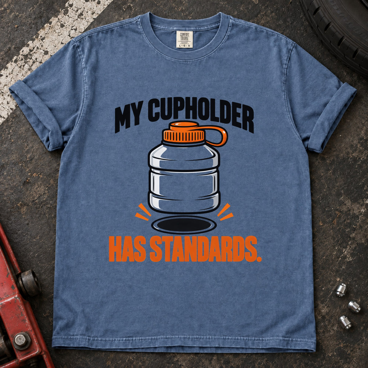 Blue Jean T-shirt showing an oversized bottle and cupholder with 'My cupholder has standards'.