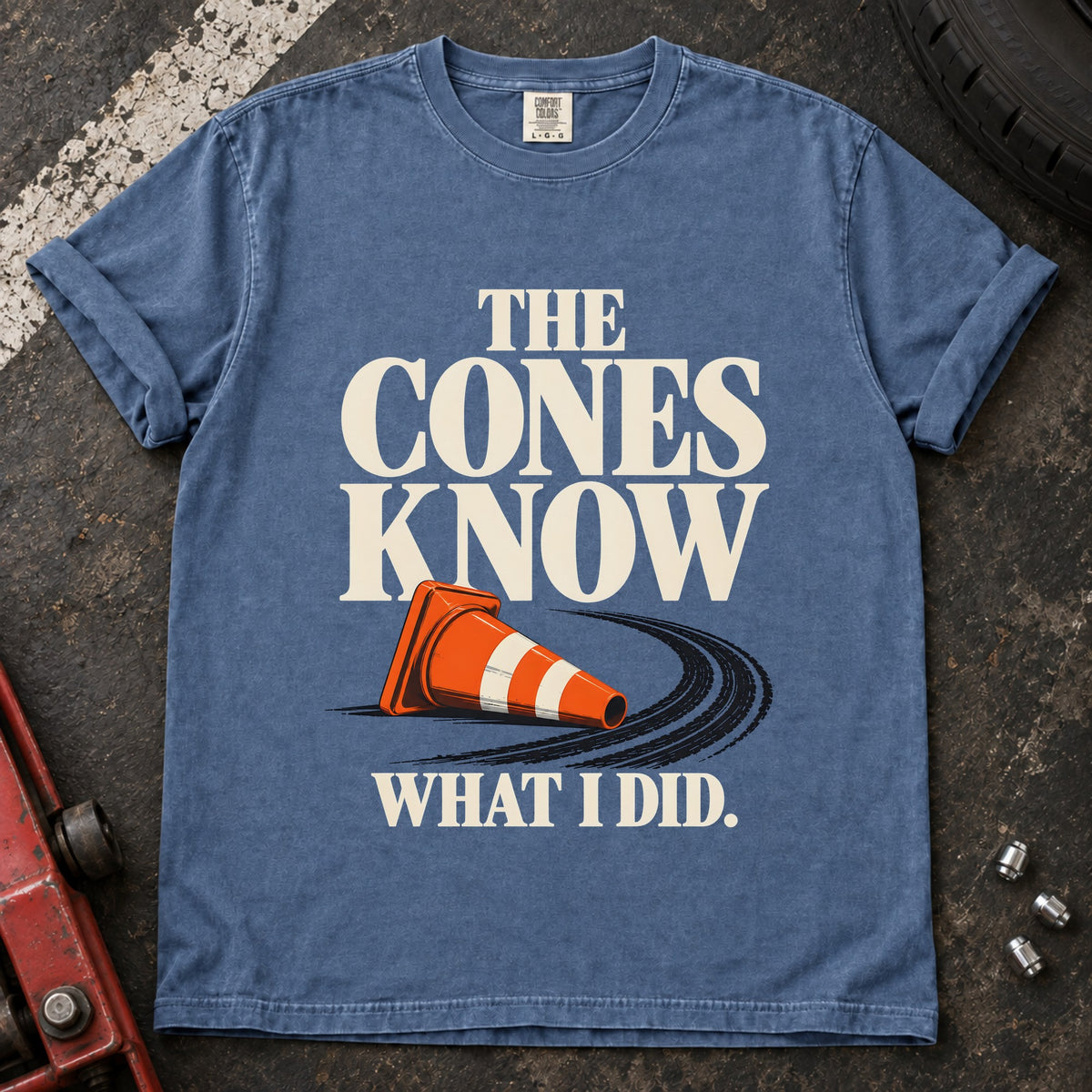 Blue Jean T-shirt showing a fallen orange traffic cone with 'The cones know what I did'.