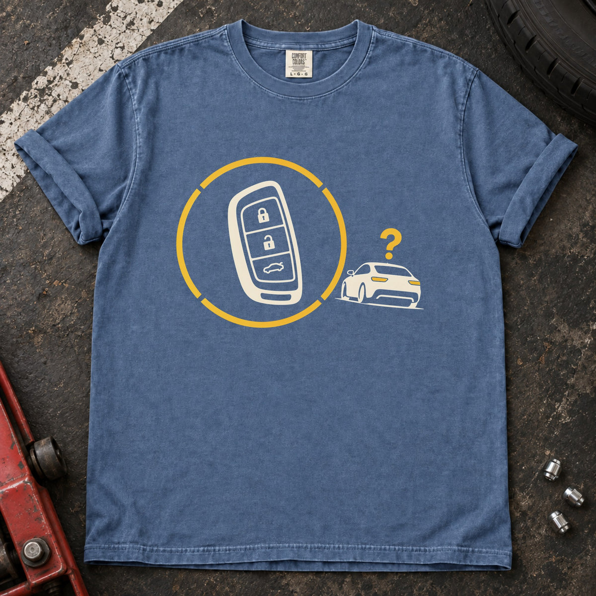 Blue Jean T-shirt with a key fob inside a circular signal graphic beside a small car and question mark.