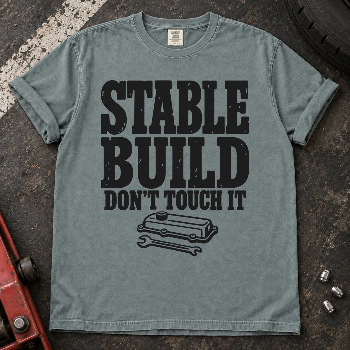 Bay car enthusiast T-shirt. A valve cover and wrench mark a stable build, don't touch it.