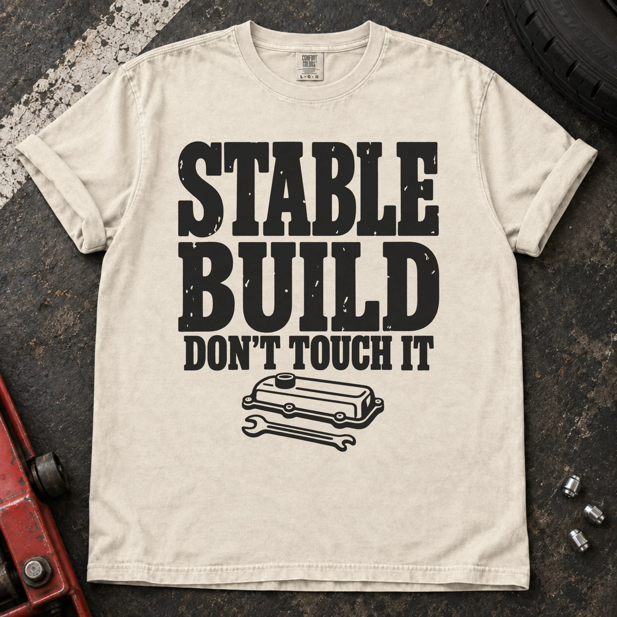 Ivory car enthusiast T-shirt. A valve cover and wrench mark a stable build, don't touch it.