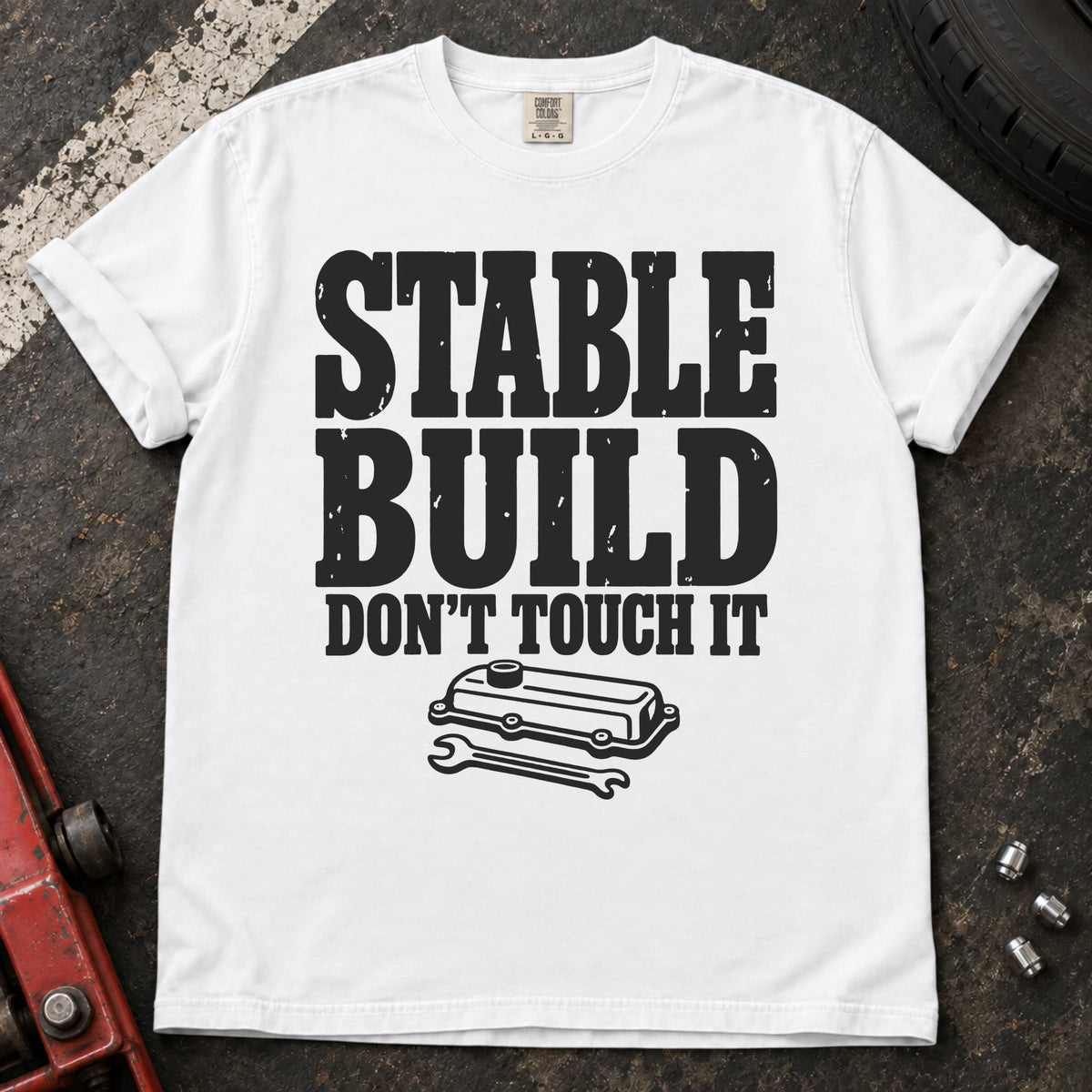 White car enthusiast T-shirt. A valve cover and wrench mark a stable build, don't touch it.