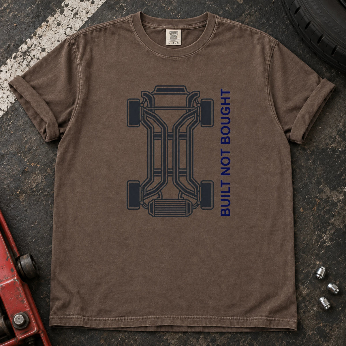 Espresso car enthusiast T-shirt. A chassis outline celebrates built, not bought.