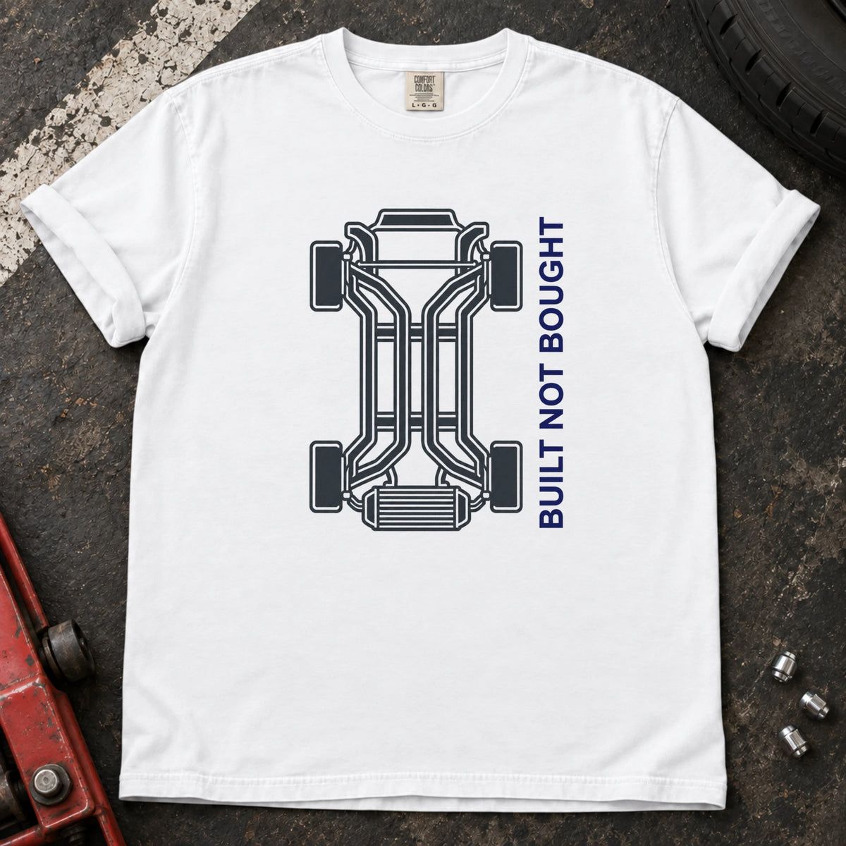 White car enthusiast T-shirt. A chassis outline celebrates built, not bought.