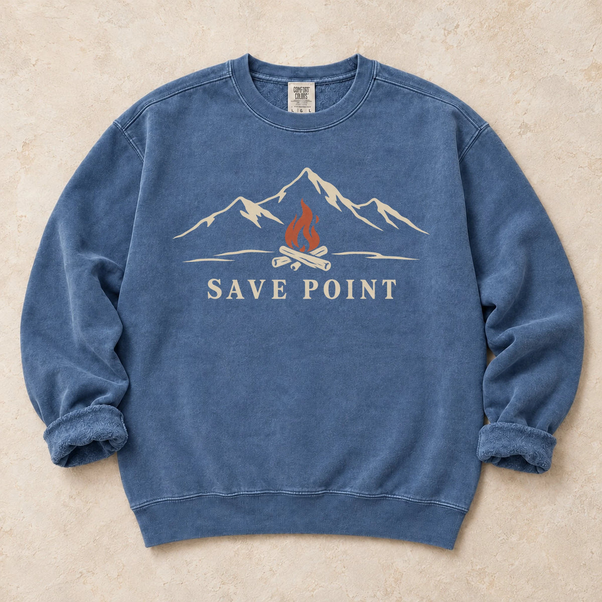 Blue Jean gaming sweatshirt. A mountain campfire becomes a quiet save point.