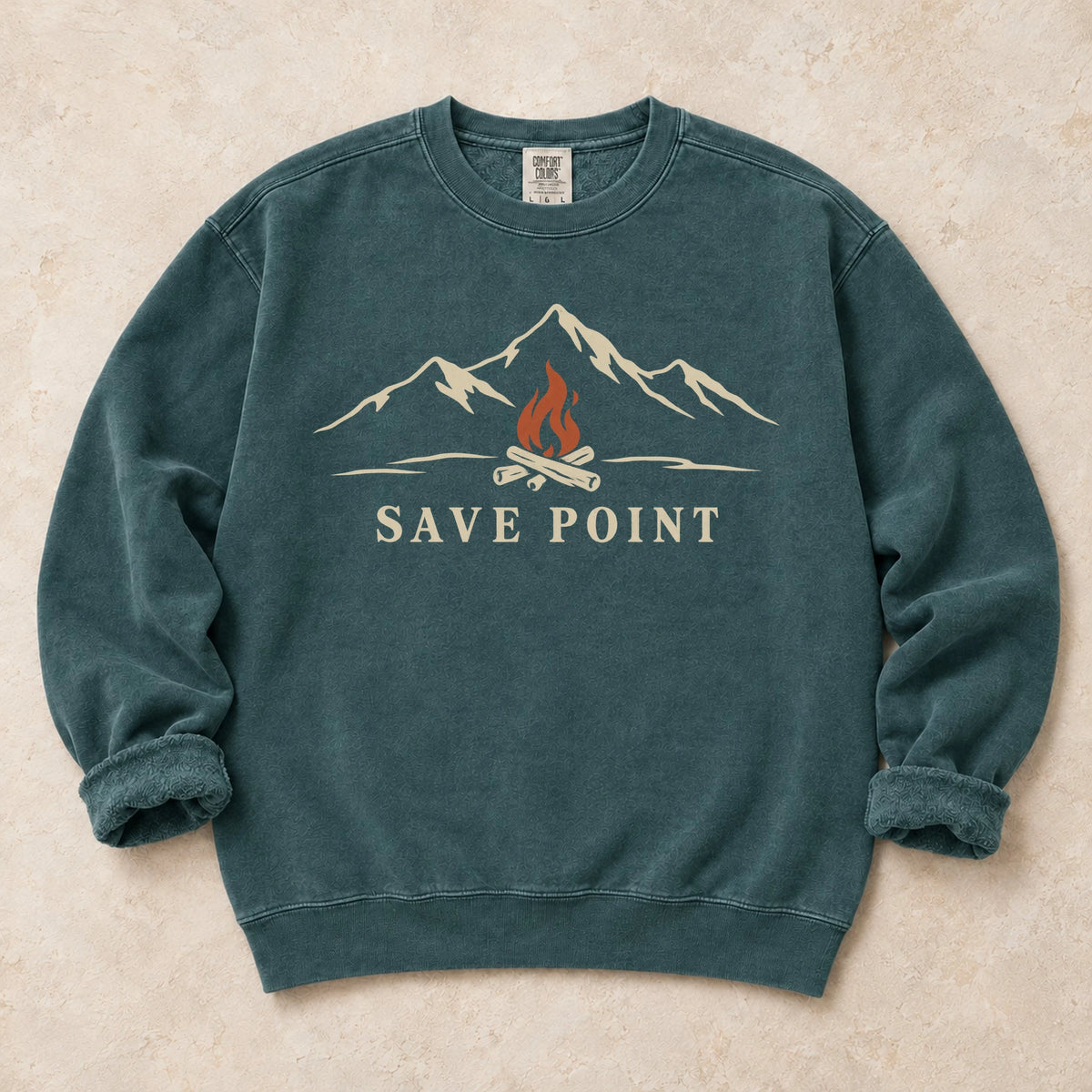 Blue Spruce gaming sweatshirt. A mountain campfire becomes a quiet save point.