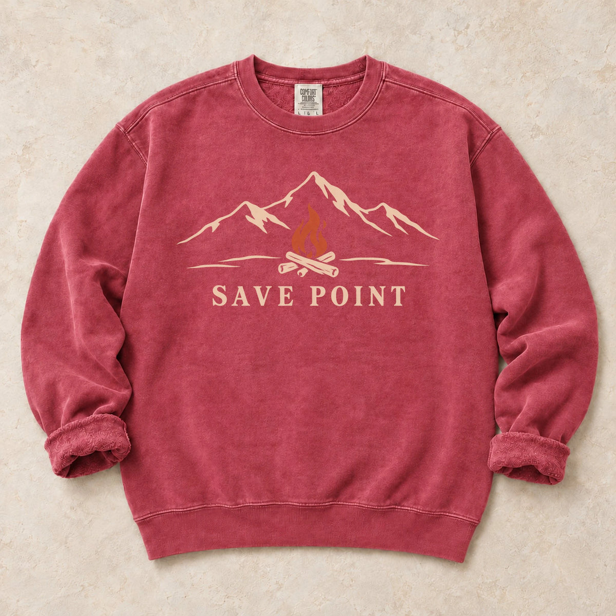 Crimson gaming sweatshirt. A mountain campfire becomes a quiet save point.