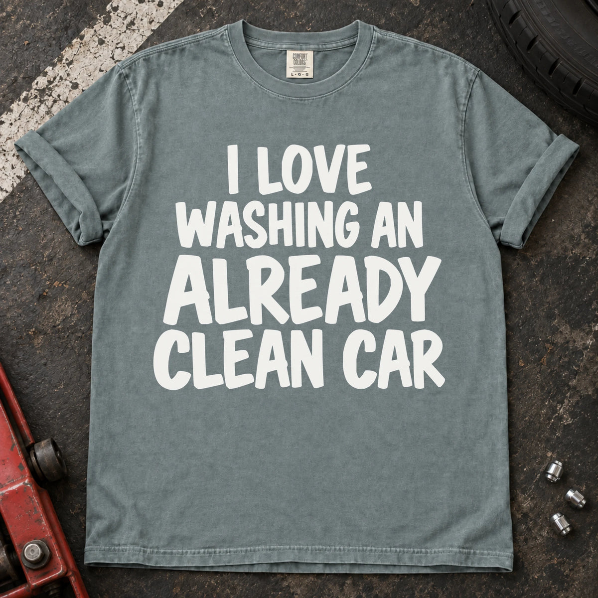Bay T-shirt with bold lettering reading 'I love washing an already clean car'.