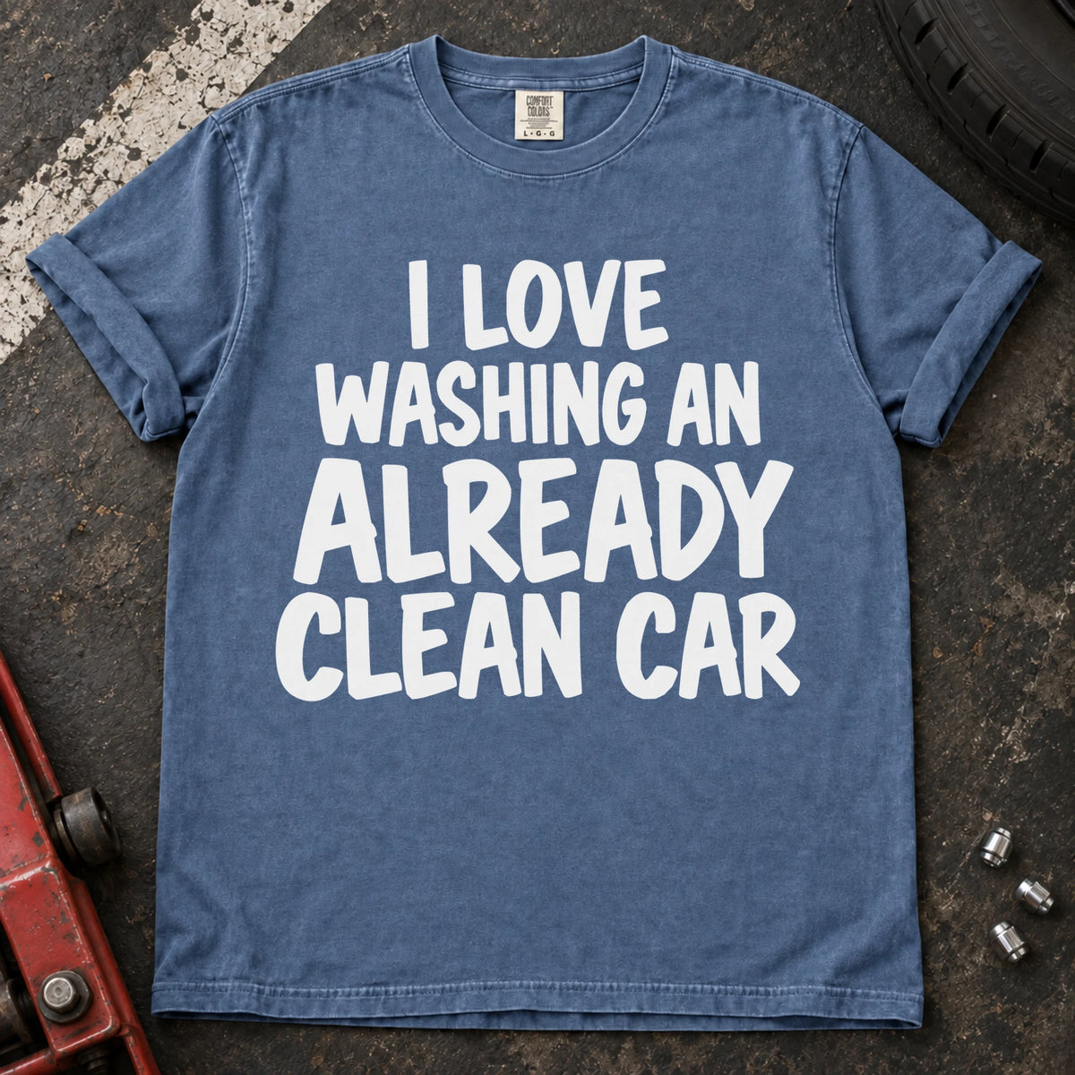 Blue Jean T-shirt with bold lettering reading 'I love washing an already clean car'.
