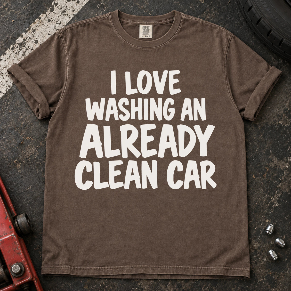 Espresso T-shirt with bold lettering reading 'I love washing an already clean car'.