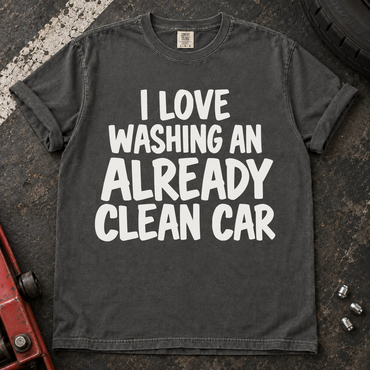 Pepper T-shirt with bold lettering reading 'I love washing an already clean car'.