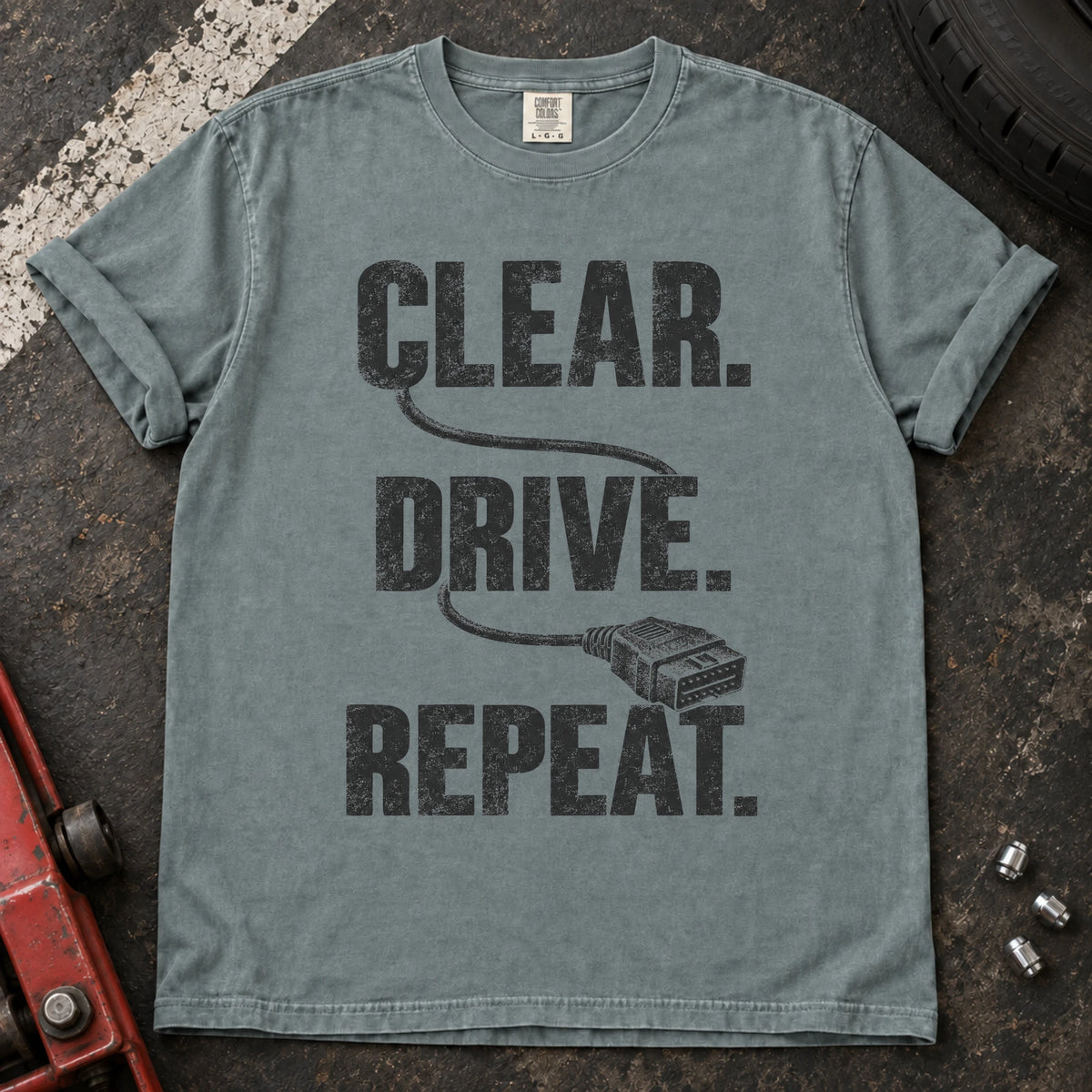 Bay car enthusiast T-shirt. A diagnostic cable connects clear, drive, repeat.